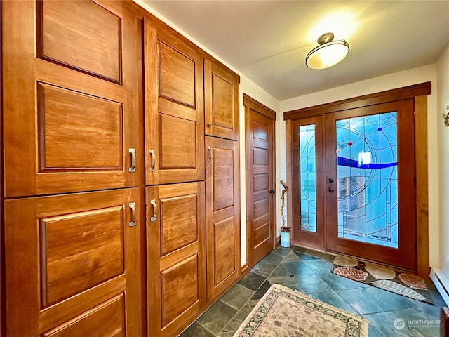 entryway with a baseboard heating unit