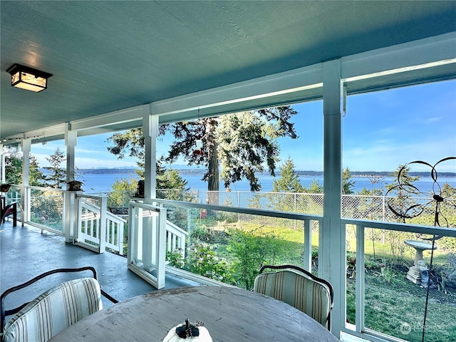 sunroom with a water view