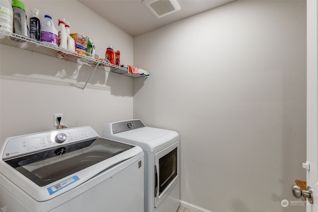 laundry area with independent washer and dryer