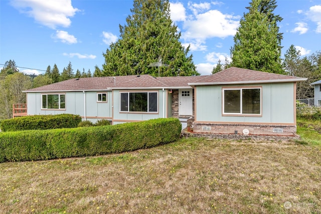 single story home with a front yard