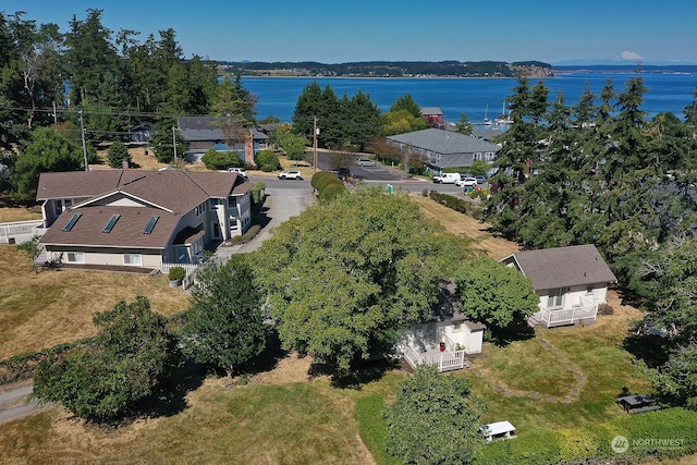 birds eye view of property with a water view