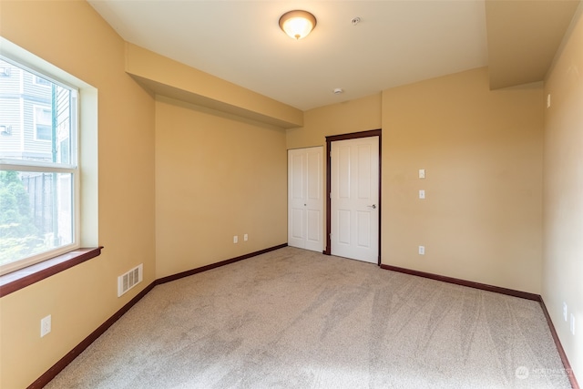 unfurnished bedroom with carpet