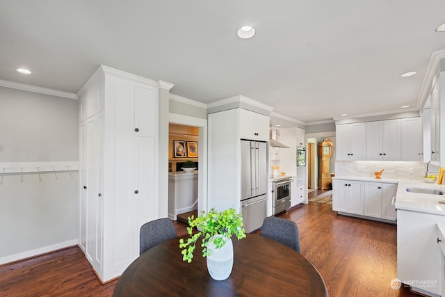 1406 Mcgilvra Blvd E, Seattle, WA 98112 - dining room with ornamental molding, sink, and dark wood-type flooring