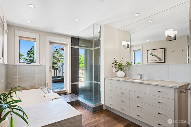 1406 Mcgilvra Blvd E, Seattle, WA 98112 - bathroom featuring hardwood / wood-style flooring, vanity, and separate shower and tub
