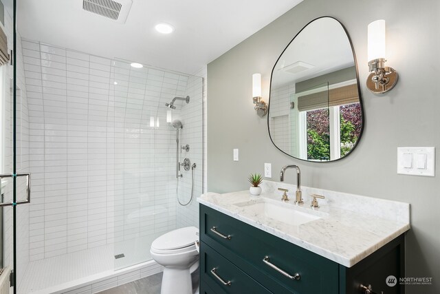 1406 Mcgilvra Blvd E, Seattle, WA 98112 - bathroom featuring vanity, toilet, and an enclosed shower