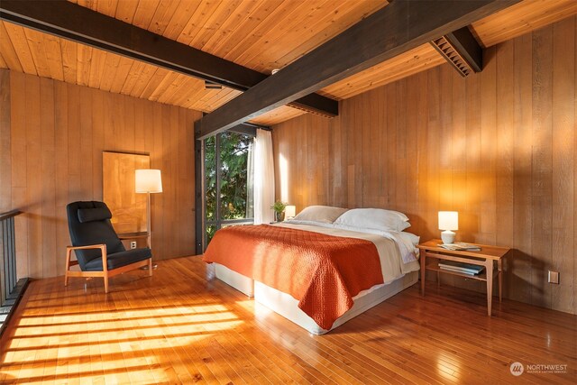 bedroom featuring wooden ceiling, wood walls, beamed ceiling, and hardwood / wood-style flooring