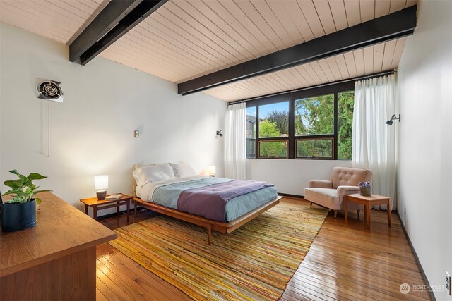 bedroom featuring wood ceiling, beam ceiling, and hardwood / wood-style floors