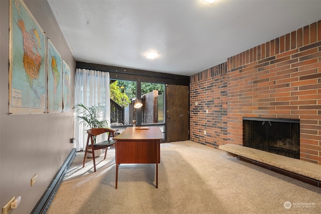 carpeted office with brick wall and a fireplace