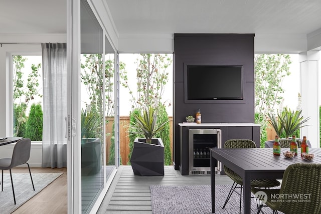 living room featuring wine cooler and wood finished floors