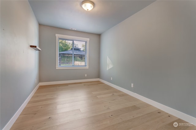 unfurnished room featuring light hardwood / wood-style flooring