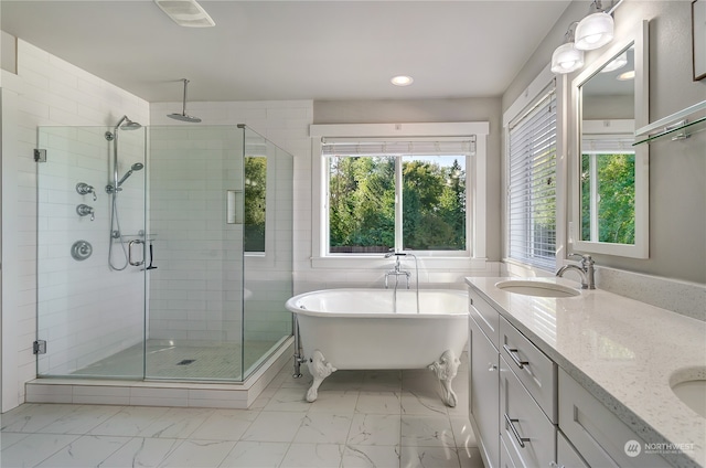 bathroom featuring independent shower and bath and vanity