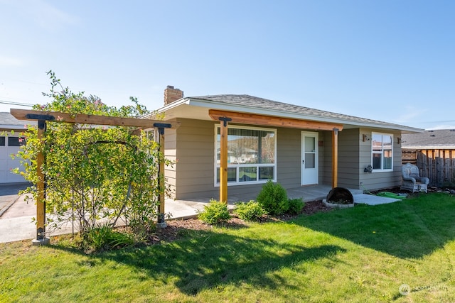 single story home with a front lawn and a garage