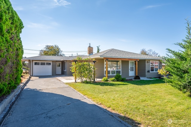 single story home featuring a garage and a front yard