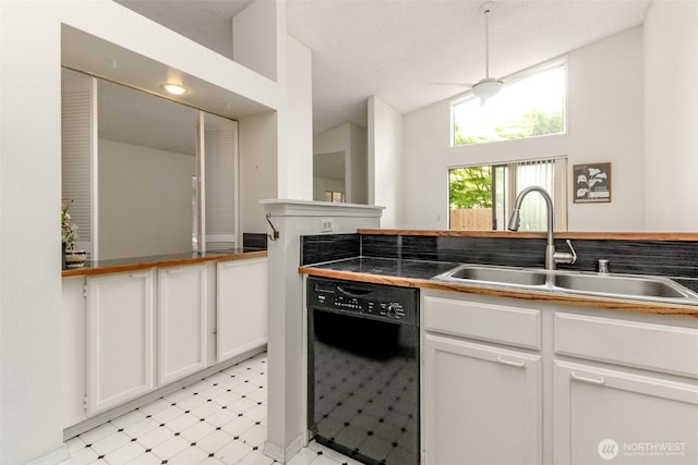 31717 48th Ln SW Unit A, Federal Way, WA 98023 - kitchen with black dishwasher, light floors, a sink, white cabinets, and vaulted ceiling