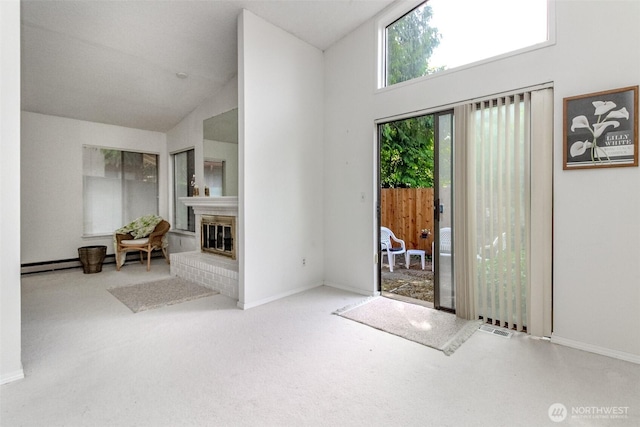31717 48th Ln SW Unit A, Federal Way, WA 98023 - carpeted foyer featuring high vaulted ceiling, a glass covered fireplace, baseboards, and a baseboard radiator