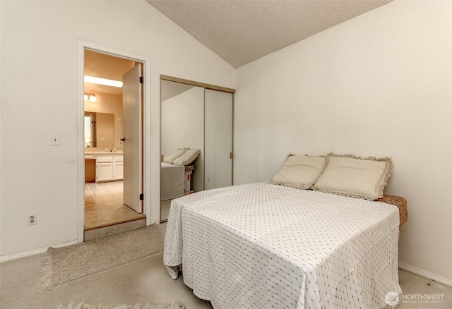 31717 48th Ln SW Unit A, Federal Way, WA 98023 - bedroom featuring vaulted ceiling, light carpet, baseboards, a closet, and a sink
