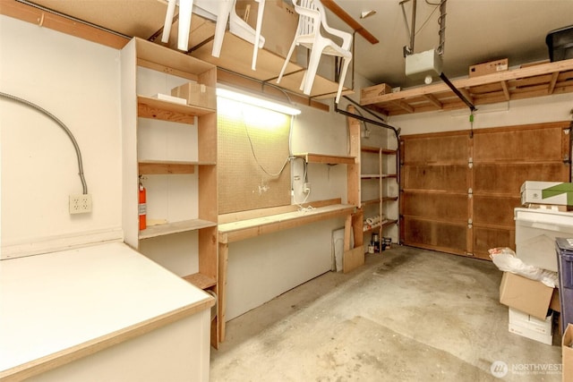 31717 48th Ln SW Unit A, Federal Way, WA 98023 - garage featuring a garage door opener and a workshop area