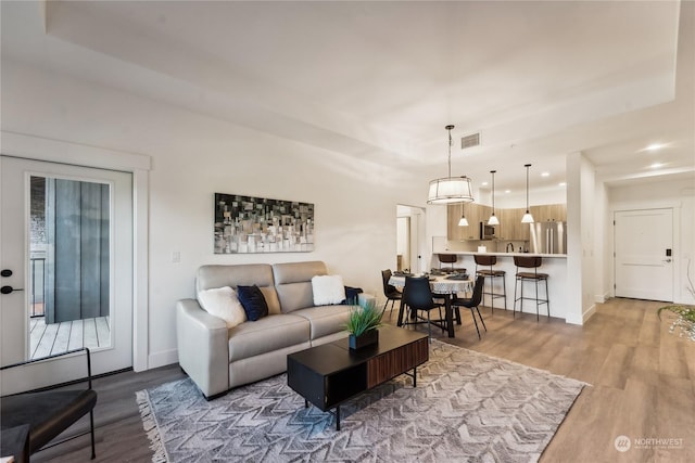 3760 Suncadia Trl Unit 313, Cle Elum, WA 98922 - living room with visible vents, recessed lighting, wood finished floors, a raised ceiling, and baseboards
