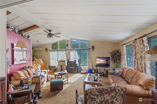 carpeted living room with ceiling fan and lofted ceiling with beams