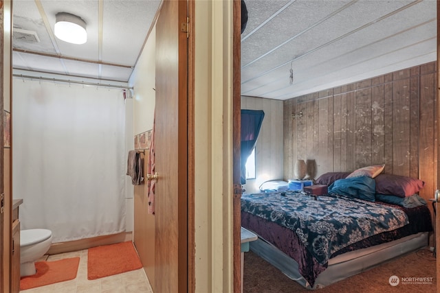 bedroom with wooden walls