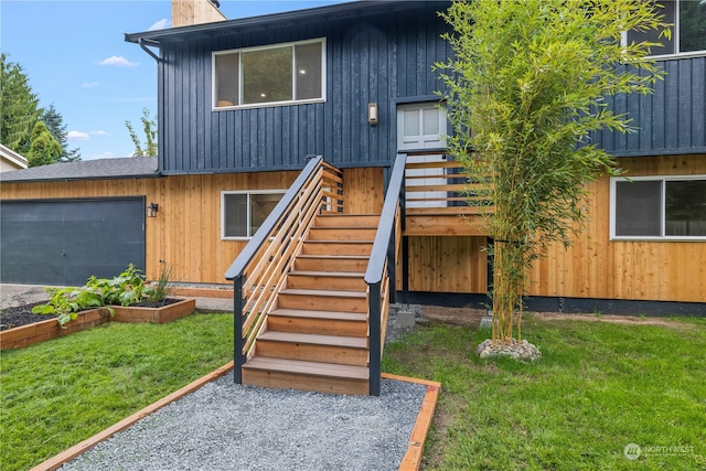 view of front facade with a front yard and a garage