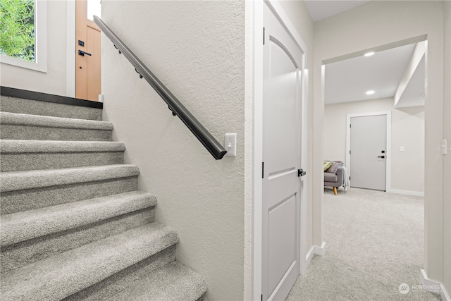 staircase with carpet flooring