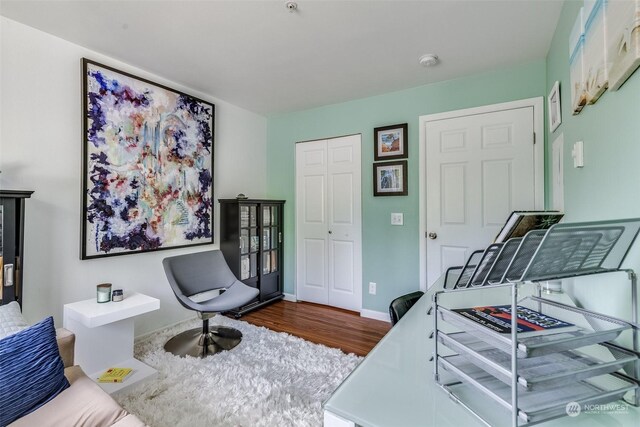 bedroom featuring a closet and dark hardwood / wood-style floors