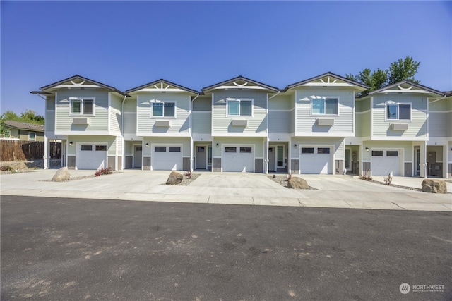 townhome / multi-family property featuring a garage