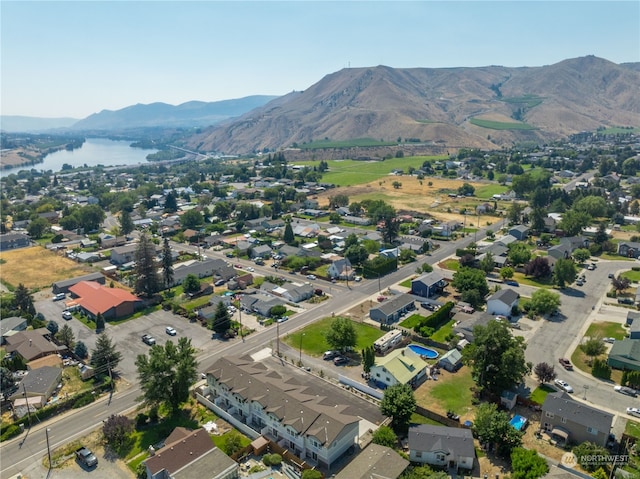 bird's eye view featuring a water and mountain view