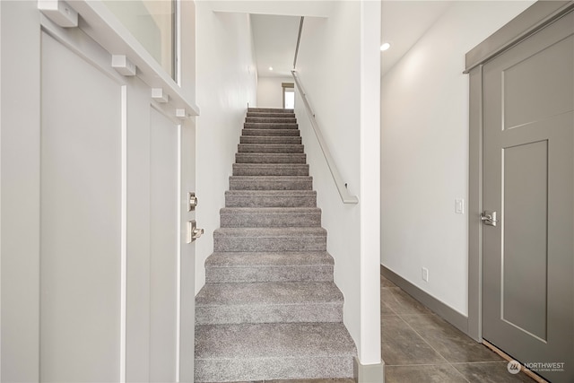 staircase with tile patterned flooring