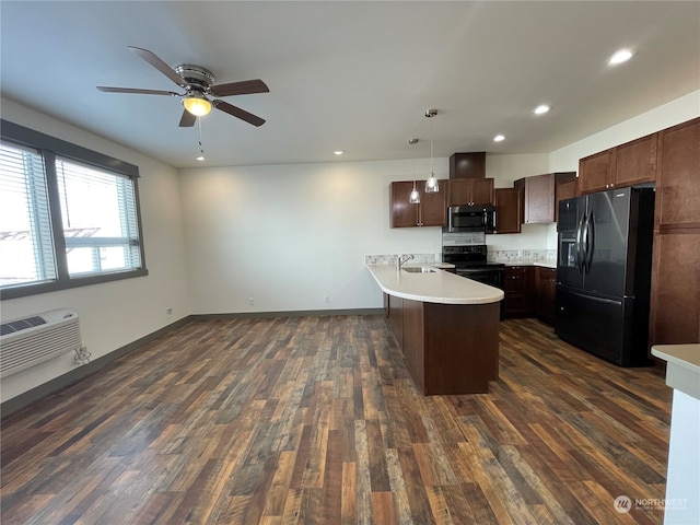 kitchen with pendant lighting, black appliances, ceiling fan, and dark hardwood / wood-style floors