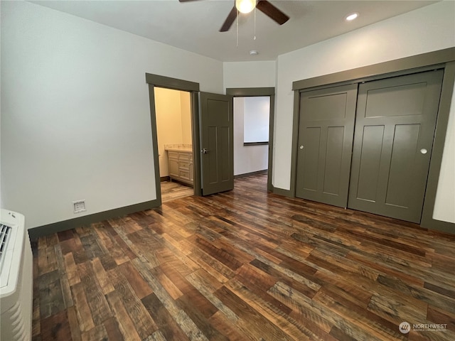 unfurnished bedroom featuring ceiling fan, dark wood-type flooring, and a closet