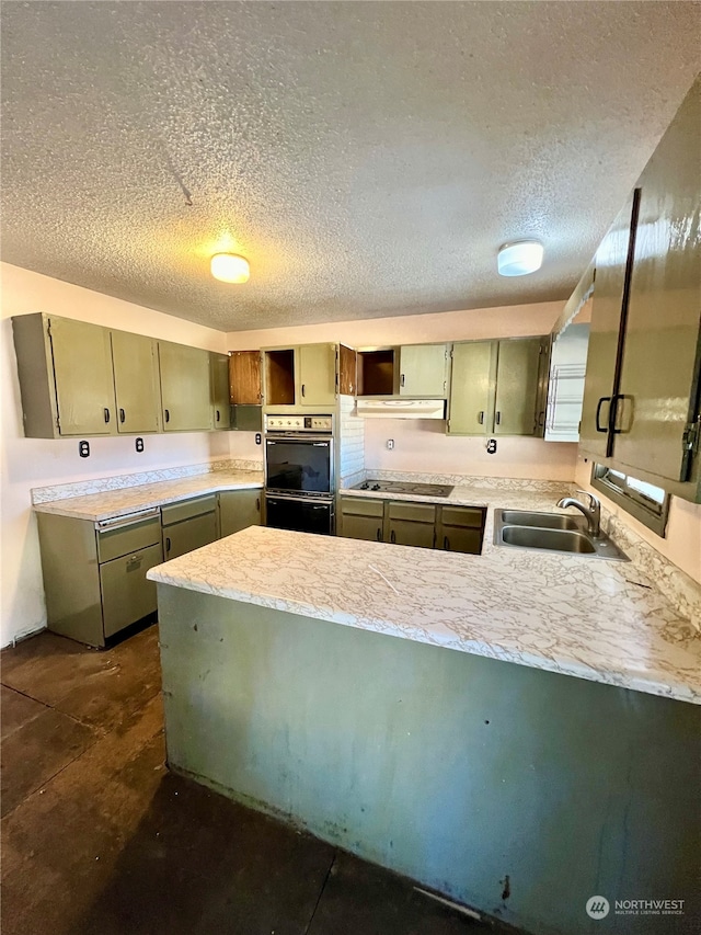 kitchen featuring a textured ceiling, sink, kitchen peninsula, cooktop, and double oven