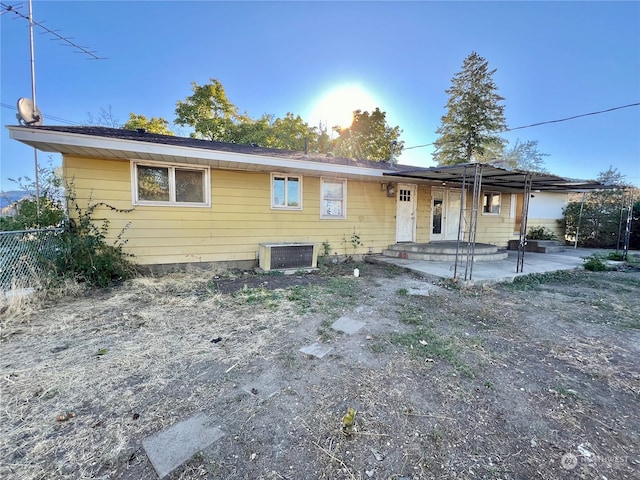 back of house with a patio