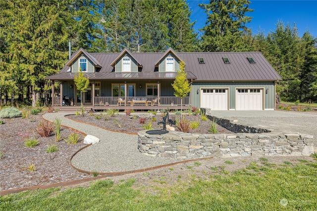 view of front of house with a garage and a porch