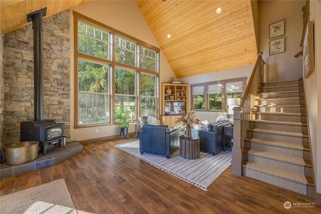 unfurnished living room with wood ceiling, dark hardwood / wood-style floors, and high vaulted ceiling