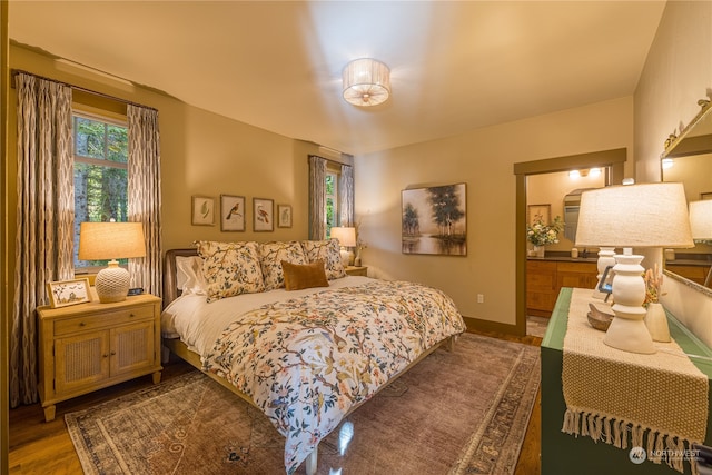 bedroom with dark hardwood / wood-style flooring