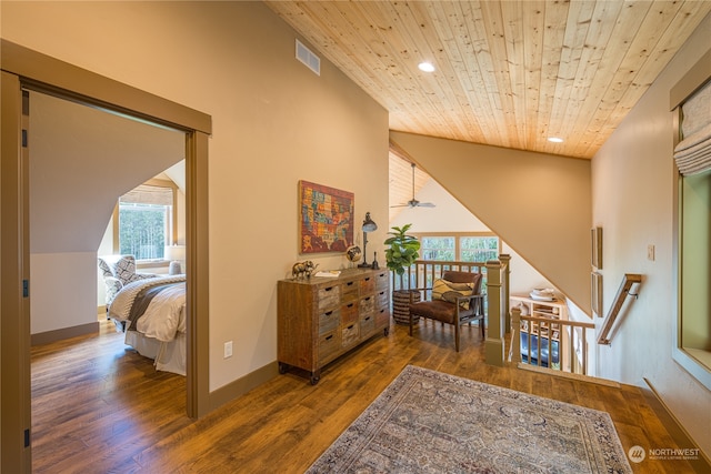 hall featuring wood ceiling, a wealth of natural light, lofted ceiling, and dark hardwood / wood-style floors