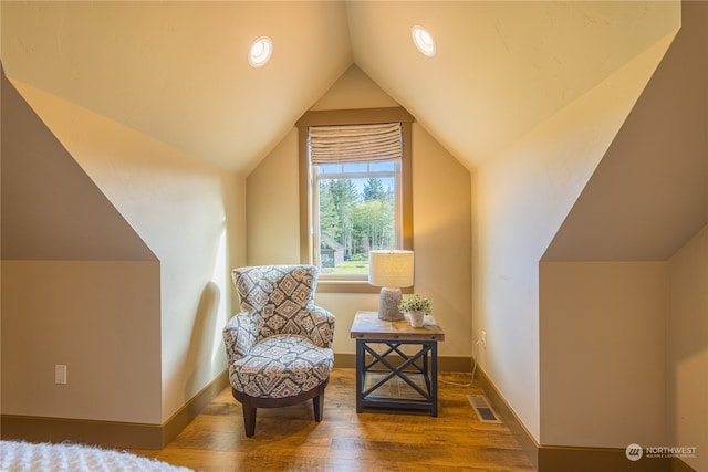 sitting room with lofted ceiling and dark hardwood / wood-style floors