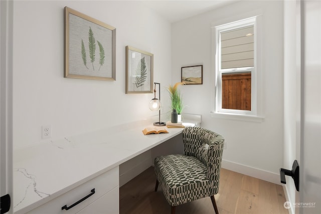 home office with light wood-type flooring