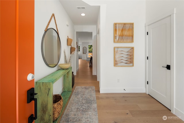 corridor featuring light hardwood / wood-style floors