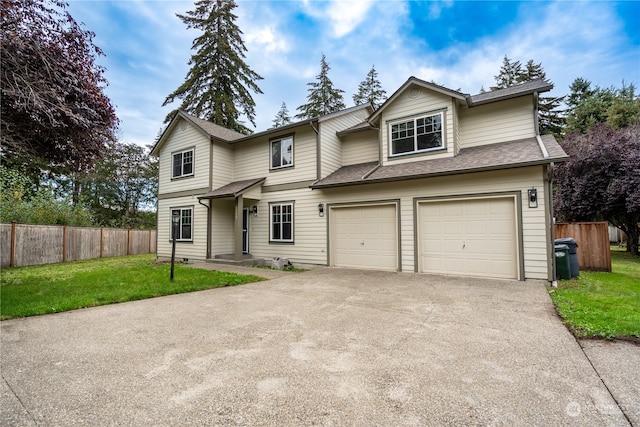 front of property with a garage and a front lawn