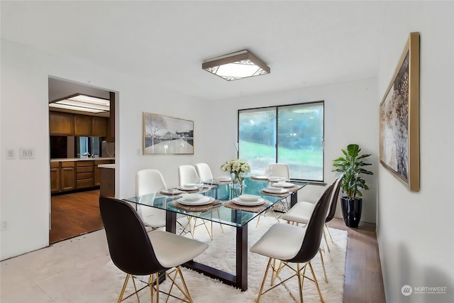 dining area with light hardwood / wood-style flooring