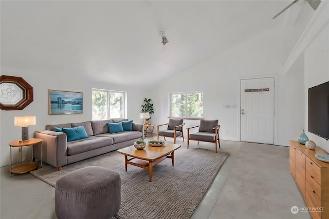 living room featuring a healthy amount of sunlight, ceiling fan, and high vaulted ceiling