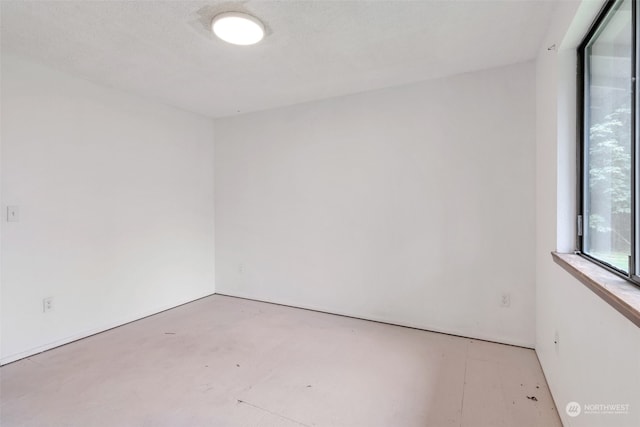 empty room with a textured ceiling