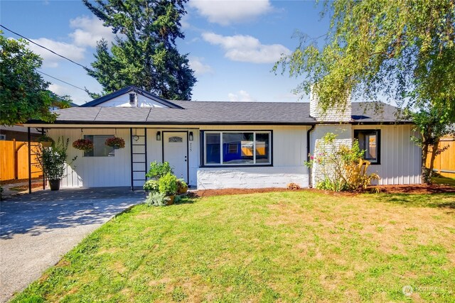 ranch-style home with a front lawn