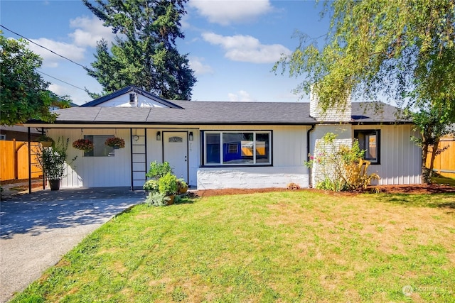 single story home with fence, driveway, and a front lawn