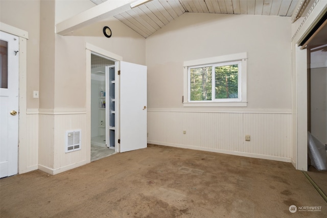 carpeted empty room featuring wooden walls, lofted ceiling, and wood ceiling