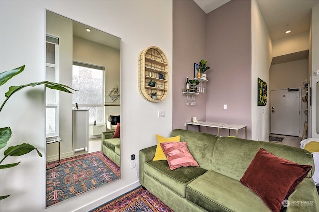 living room with a towering ceiling