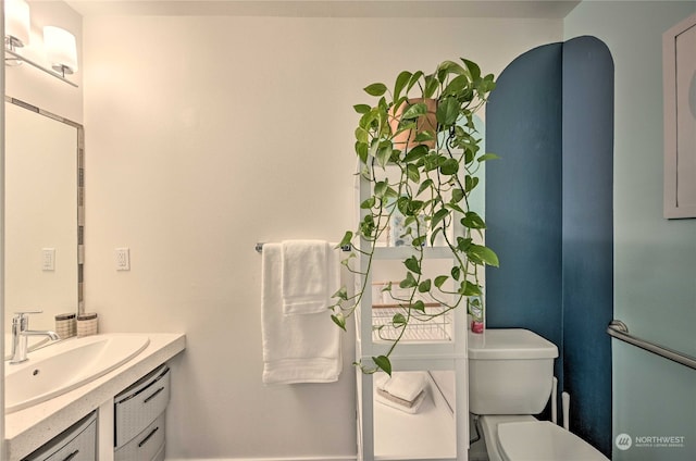 bathroom with vanity and toilet